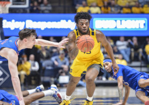Wilson, Okonkwo lead WVU past Texas Tech to end Big 12 road losing streak
